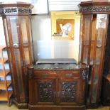 An early 20th century continental carved mahogany display cabinet,