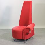 A modern red upholstered high back side chair