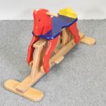 A painted wooden rocking horse, by John Crane,