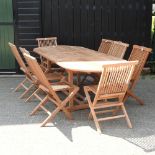 A teak extending oval garden table, 240 x 100cm,