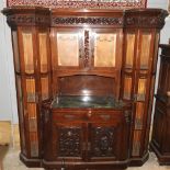 An early 20th century continental carved mahogany display cabinet,