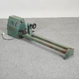 A Nu Tools electric woodworking lathe, 124cm long,