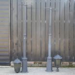 A pair of cast iron lamp posts,