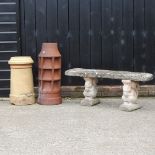 A reconstituted stone garden bench, together with two glazed chimney pots,