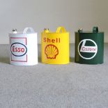 Three painted advertising petrol cans,