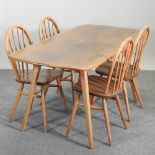 A 1970's Ercol medium elm dining table, 154 x 76cm,