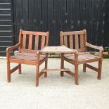 A hardwood garden conversation chair,