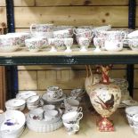 Two shelves of Crown Staffordshire teawares,