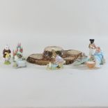 A collection of Beswick Bunnykins figures, together with other figures, on stand,