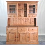 A modern pine dresser, with a glazed upper section,