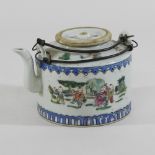 A Chinese porcelain teapot and cover, with a wire handle,