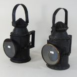 A pair of reproduction metal railway lanterns,