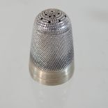 A Victorian novelty silver pepper, in the form of a giant thimble, RD206738, Birmingham 1881,