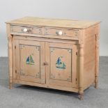 An early 20th century continental pine side cabinet, with painted decoration,