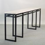 A metal framed bar table, with a travertine top, 211 x 38cm,