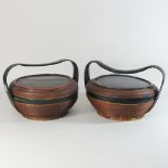 A pair of ebonised and wicker rice carriers,