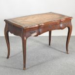 An early 20th century continental inlaid writing table, on cabriole legs,