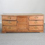 An 18th century pine dresser base,