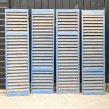 Two pairs of blue painted wooden shutters,