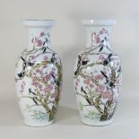 A pair of modern Chinese porcelain vases, decorated with birds and flowers,