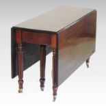 A William IV mahogany drop leaf dining table,