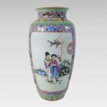 A Chinese porcelain vase, decorated with figures, red seal marks to base,