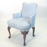 An early 20th century blue upholstered Queen Anne style armchair,