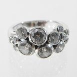 An 18 carat diamond cluster ring,