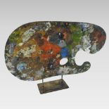 An artist's palette, on a metal stand, inscribed SIR CEDRIC MORRIS,