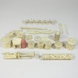 A collection of 19th century Chinese carved ivory crochet and sewing implements, to include bobbins,