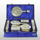 An early 20th century silver seven piece dressing table set, Birmingham 1917,