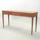 A good quality walnut hall table, containing three short drawers, on turned legs,