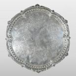 A Victorian silver salver, of lobed circular shape, with a gadrooned border, engraved with flowers,