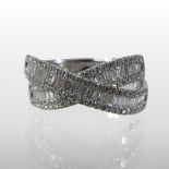 An 18 carat white gold diamond ring, of crossover design, approximately 0.