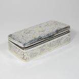 An ornate Victorian silver table cigarette box, of rectangular shape,