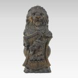 A 17th century style carved oak model of an heraldic lion, shown upright,