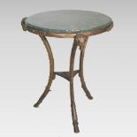 A continental bronze marble top occasional table, of circular shape, on three legs,