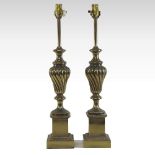 A pair of brassed table lamps, each in the form of a fluted urn,