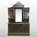 A 19th century continental carved walnut buffet,