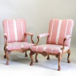 A pair of large pink upholstered armchairs,