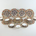 A Crown Derby Imari 1128 pattern part dinner service, comprising seven dinner plates, 27cm diameter,