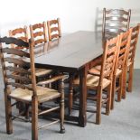 A large oak refectory dining table, on a chamfered base, united by an H shaped stretcher,