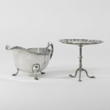 An early 20th century silver sauce boat, of helmet shape, Birmingham 1908, 16cm long,