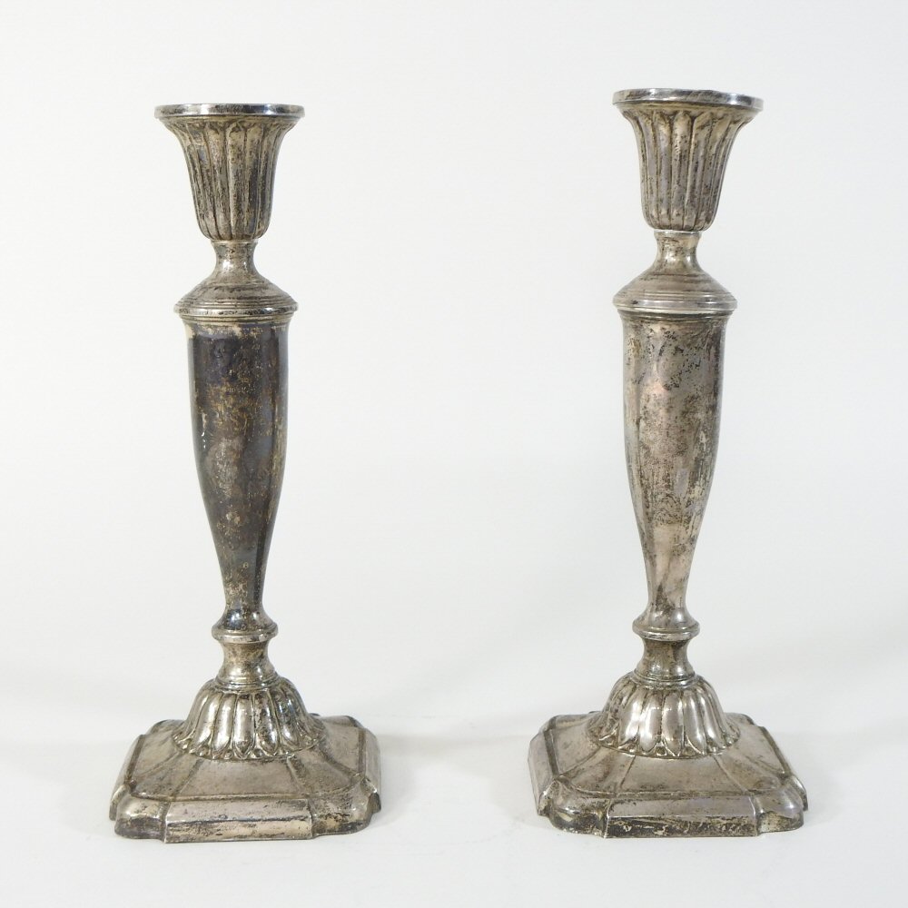 A pair of early 20th century American sterling silver table candlesticks, each of Classical style,