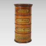 A 19th century fruitwood spice tower, having four tiers inscribed MACE, CLOVES, NUTMEG and CINNAMON,