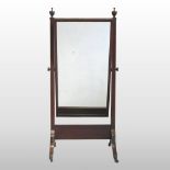 An Edwardian mahogany and inlaid cheval mirror, having an adjustable rectangular bevelled plate,