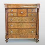 A 19th century burr walnut chest, containing an arrangement of drawers, with glass handles,