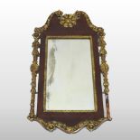 A 19th century Federal style parcel gilt framed wall mirror, with a broken pediment,