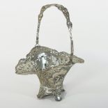 A continental Art Nouveau pieced silver basket, with a swing handle, of pierced form,