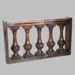 An 18th century Italian turned walnut balustrade,